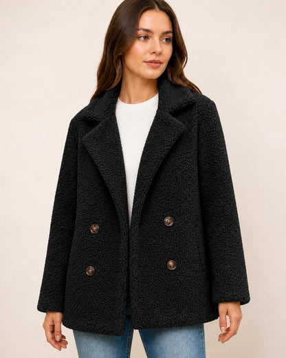 Black double-breasted teddy coat worn, color view.